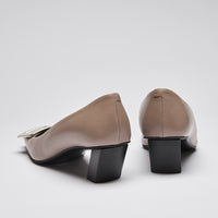 Pre-Loved Taupe Smooth Leather Square Toe Kitten Heels with Black Leather Lining and Silver Buckle Ornament.(back)