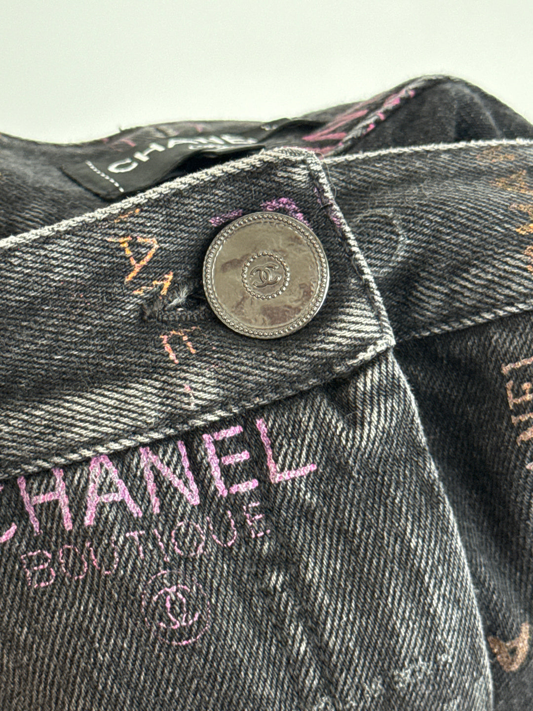 Pre-Loved Chanel™ Black Jeans with Multicolour Pink Logo Print Size 34