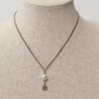 Pre-Loved Chanel™ Silver Logo Embellished Crystal Pearl Drop Necklace