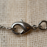 Pre-Loved Chanel™ Silver Logo Embellished Crystal Pearl Drop Necklace
