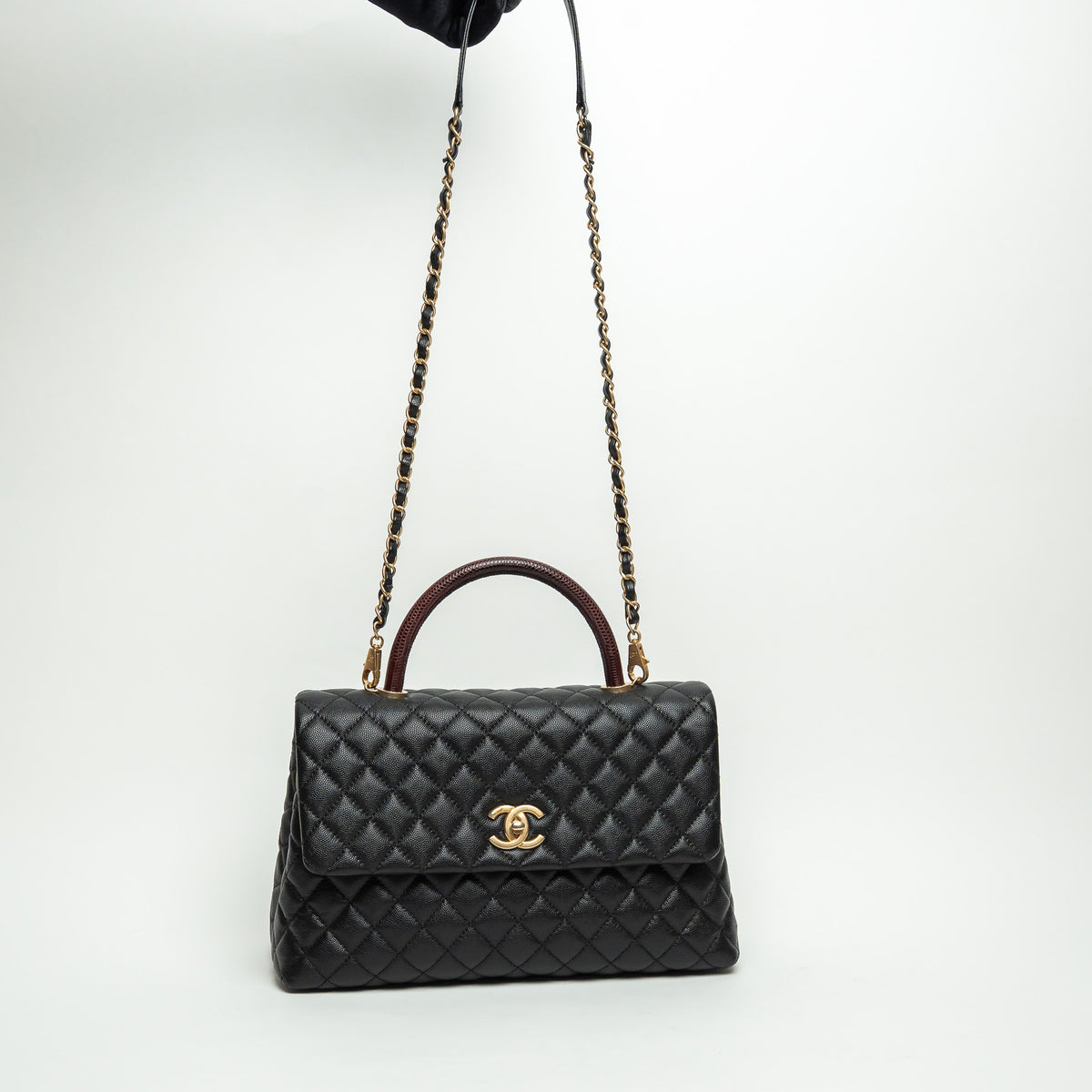 Pre-Loved Chanel™ Black Pebbled Leather Medium Coco Handle Bag with Burgundy Lizard Leather Handle