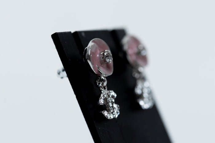 pink enamel camellia earrings with logo drop (side)
