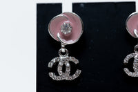 pink enamel camellia earrings with logo drop (close up)