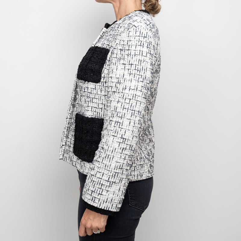 Pre-Loved Chanel™ White and Black Tweed Jacket Embellished with Faux Pearls Size 36