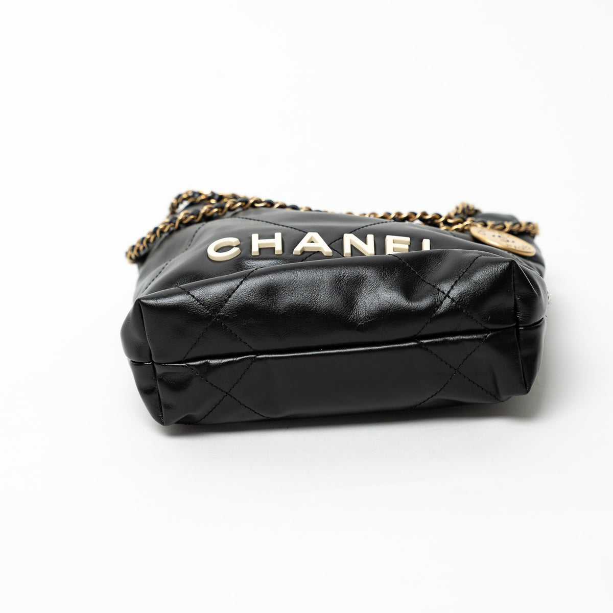 Pre-Loved Chanel™ Black Lambskin Leather Mini 22 Crossbody Bag with White Resin Logo