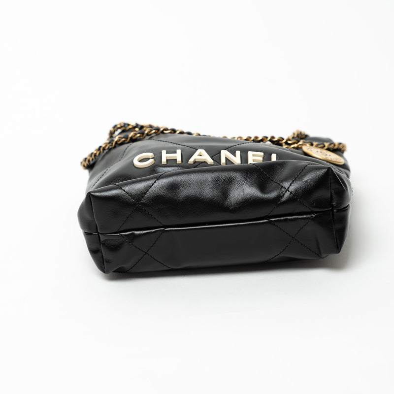 Pre-Loved Chanel™ Black Lambskin Leather Mini 22 Crossbody Bag with White Resin Logo