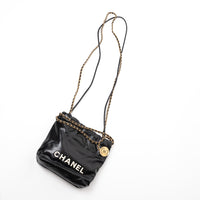 Pre-Loved Chanel™ Black Lambskin Leather Mini 22 Crossbody Bag with White Resin Logo