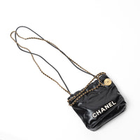 Pre-Loved Chanel™ Black Lambskin Leather Mini 22 Crossbody Bag with White Resin Logo