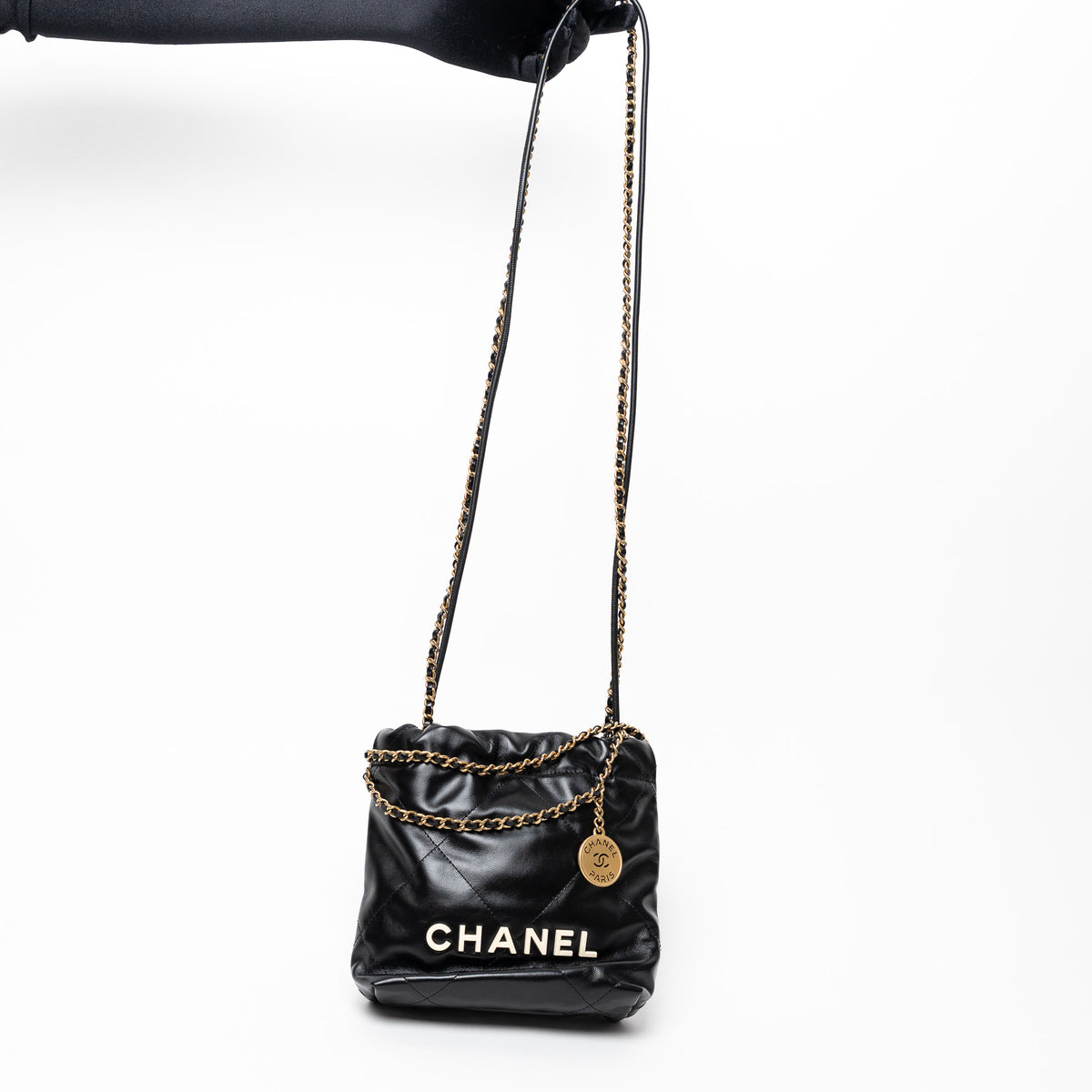 Pre-Loved Chanel™ Black Lambskin Leather Mini 22 Crossbody Bag with White Resin Logo