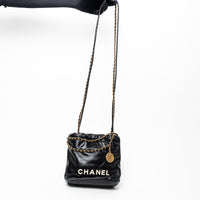 Pre-Loved Chanel™ Black Lambskin Leather Mini 22 Crossbody Bag with White Resin Logo