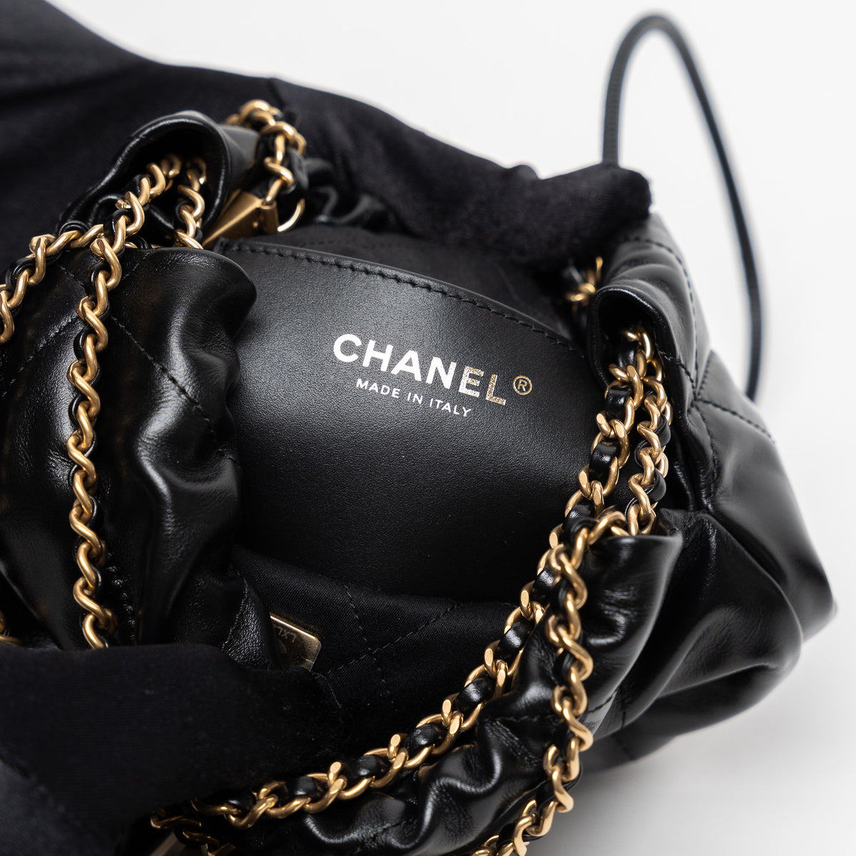 Pre-Loved Chanel™ Black Lambskin Leather Mini 22 Crossbody Bag with White Resin Logo