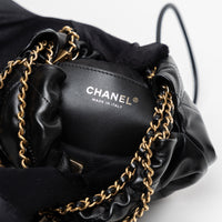 Pre-Loved Chanel™ Black Lambskin Leather Mini 22 Crossbody Bag with White Resin Logo