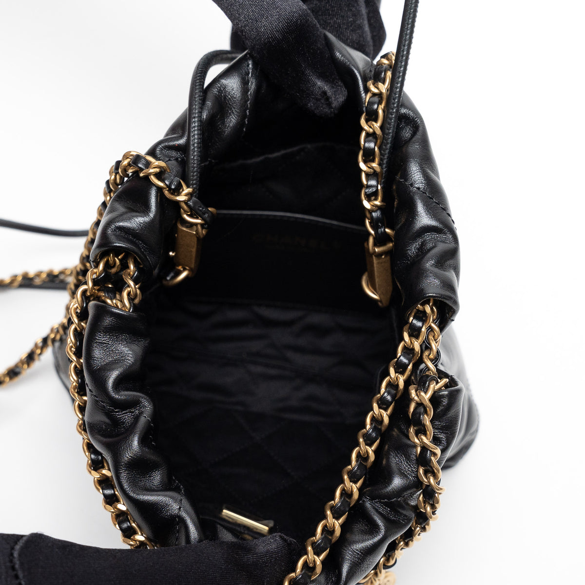 Pre-Loved Chanel™ Black Lambskin Leather Mini 22 Crossbody Bag with White Resin Logo