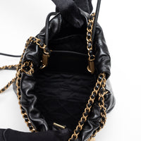 Pre-Loved Chanel™ Black Lambskin Leather Mini 22 Crossbody Bag with White Resin Logo