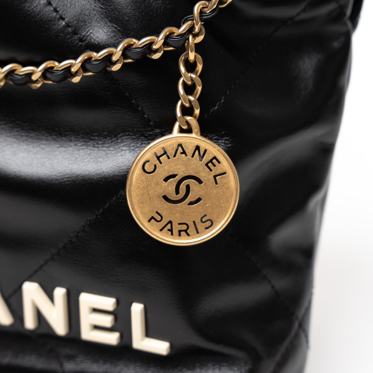 Pre-Loved Chanel™ Black Lambskin Leather Mini 22 Crossbody Bag with White Resin Logo