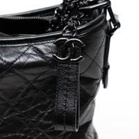 Pre-Loved Chanel™ Black Aged Calfskin Leather Medium Gabrielle Shoulder Bag with Black Hardware