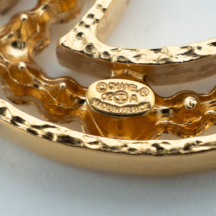 Pre-Loved Chanel™ Gold Tone Crystal Embellished Cut Out Logo Brooch