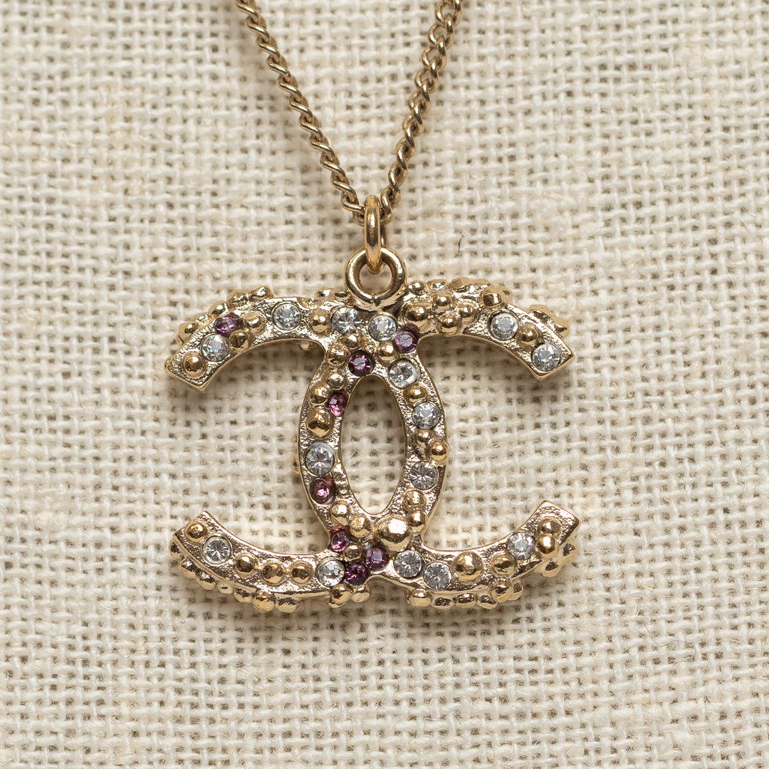 Pre-Loved Chanel™ Gold Tone Interlocking Logo Pendant Inset with Multicolor Crystals