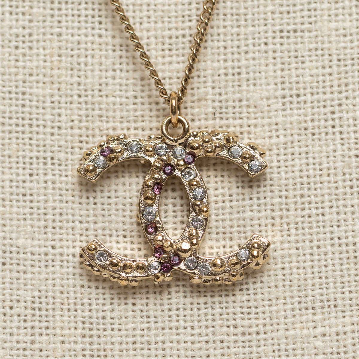 Pre-Loved Chanel™ Gold Tone Interlocking Logo Pendant Inset with Multicolor Crystals