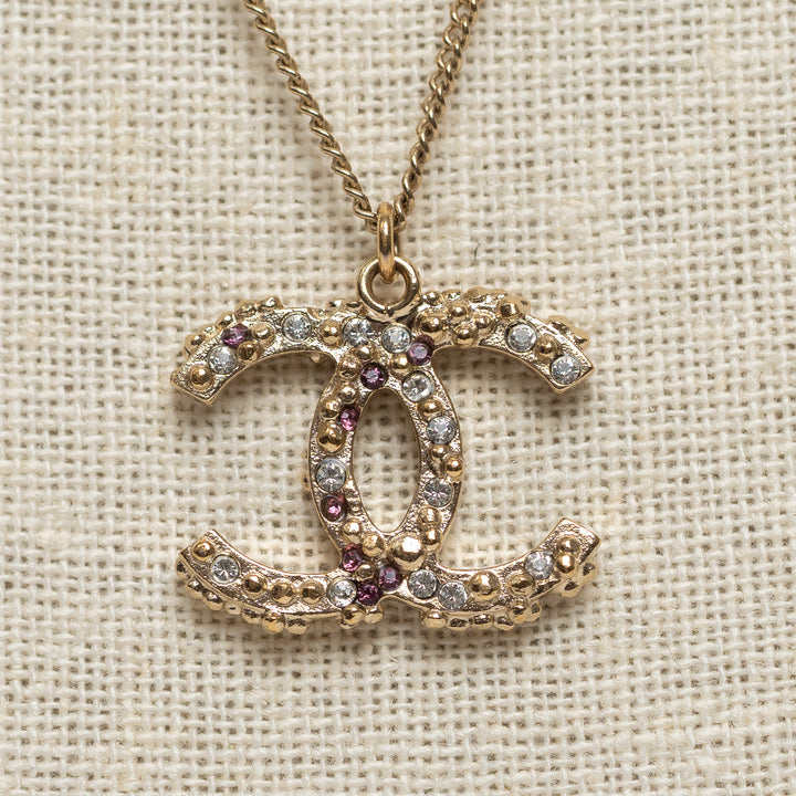 Pre-Loved Chanel™ Gold Tone Interlocking Logo Pendant Inset with Multicolor Crystals