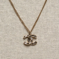 Pre-Loved Chanel™ Gold Tone Logo Pendant Necklace Inset with Clear and Black Crystals