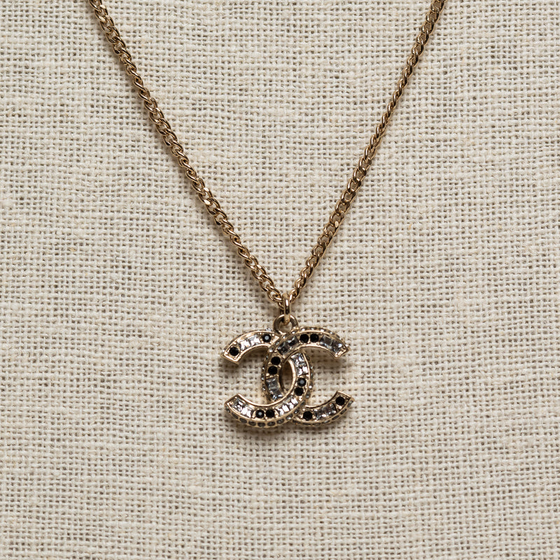 Pre-Loved Chanel™ Gold Tone Logo Pendant Necklace Inset with Clear and Black Crystals