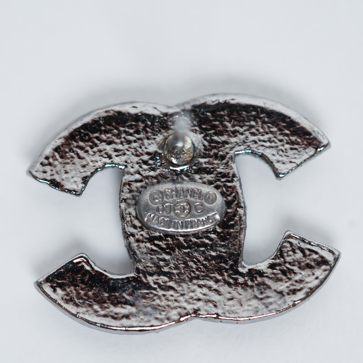 Pre-Loved Chanel™ Gunmetal Amber Crystal Logo Stud Earrings