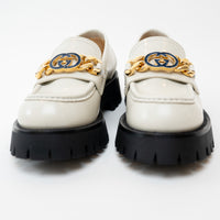 Close up front view of Gucci Gold Interlocking GG Chain White Leather Platform Loafers