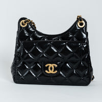 Pre-Loved Chanel™ Black Shiny Aged Calfskin Leather Small Wave Hobo Bag