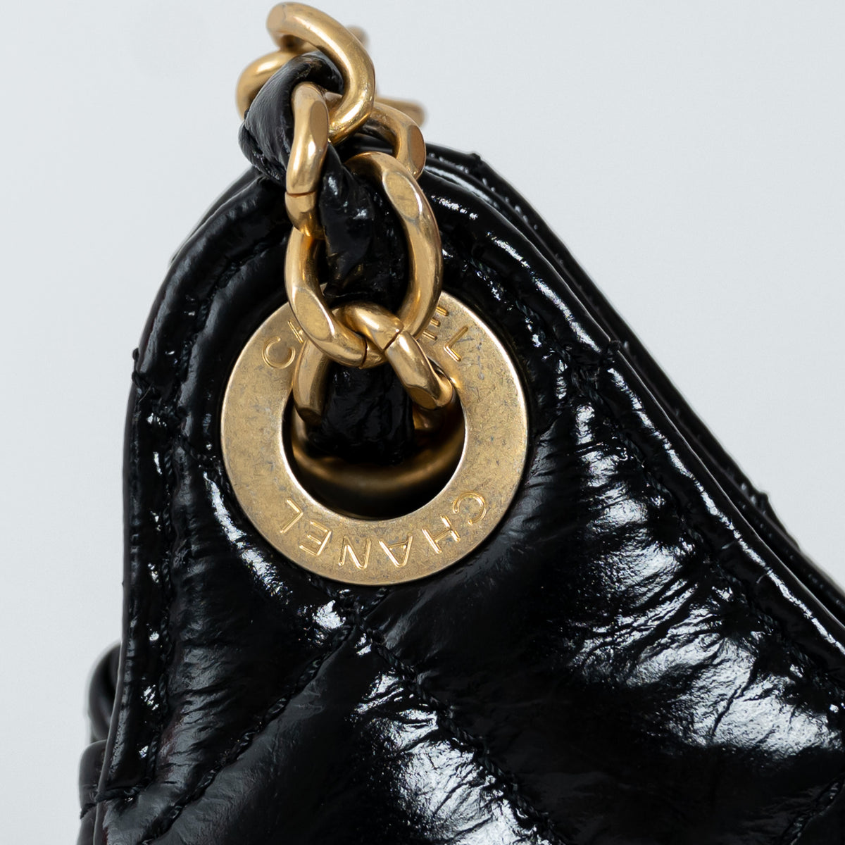 Pre-Loved Chanel™ Black Shiny Aged Calfskin Leather Small Wave Hobo Bag