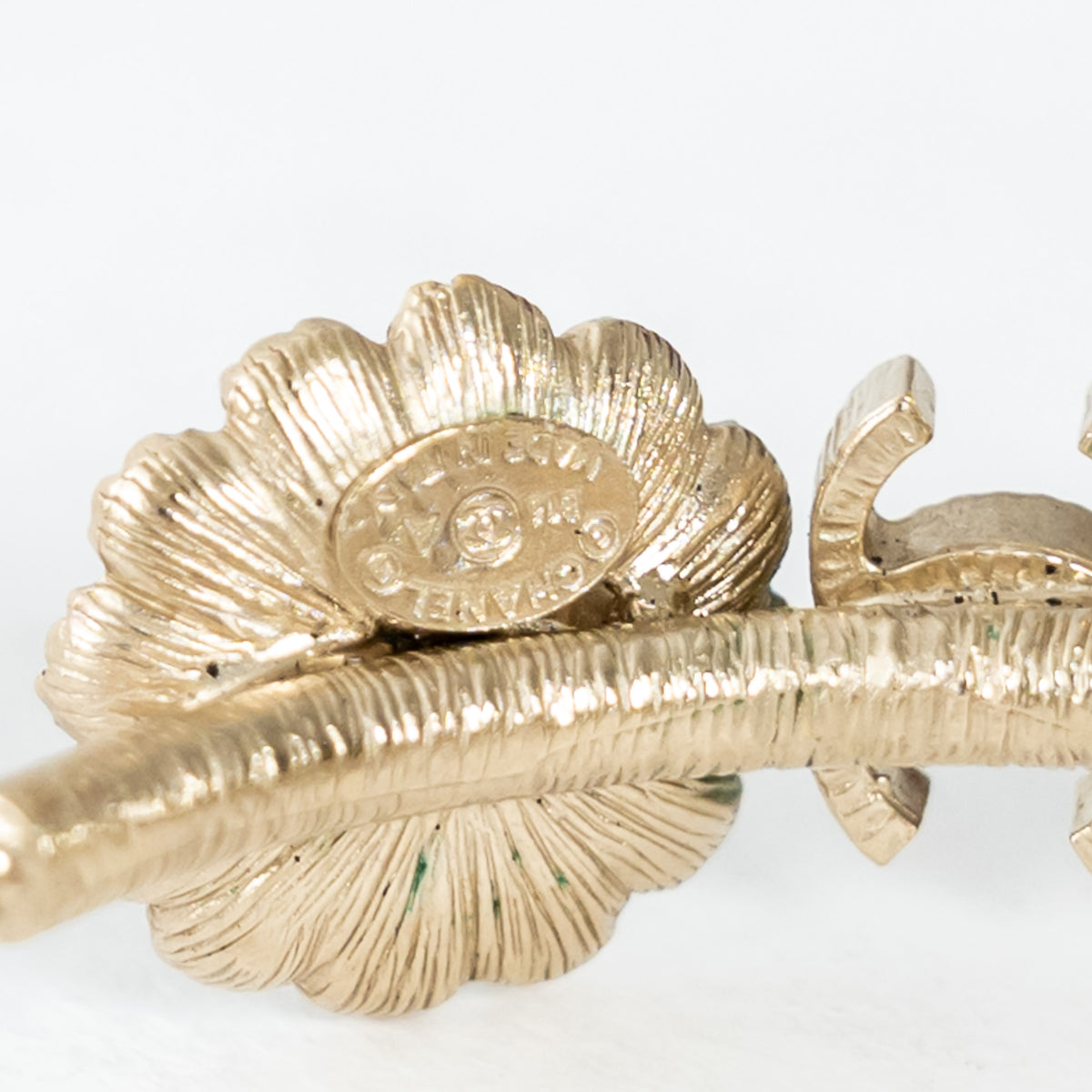 Pre-Loved Chanel™ Light Gold Tone Black Enamel Floral Hoop Earrings