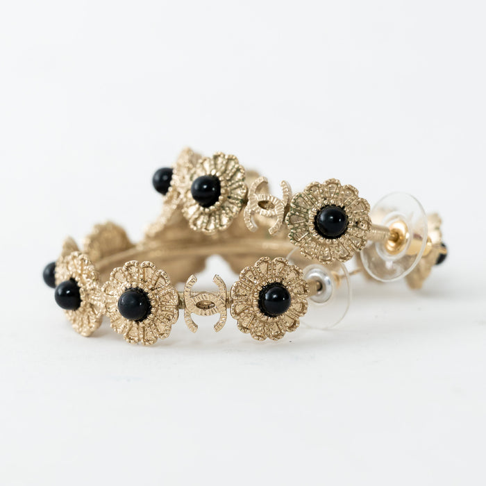 Pre-Loved Chanel™ Light Gold Tone Black Enamel Floral Hoop Earrings