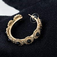 Pre-Loved Chanel™ Light Gold Tone Black Enamel Floral Hoop Earrings