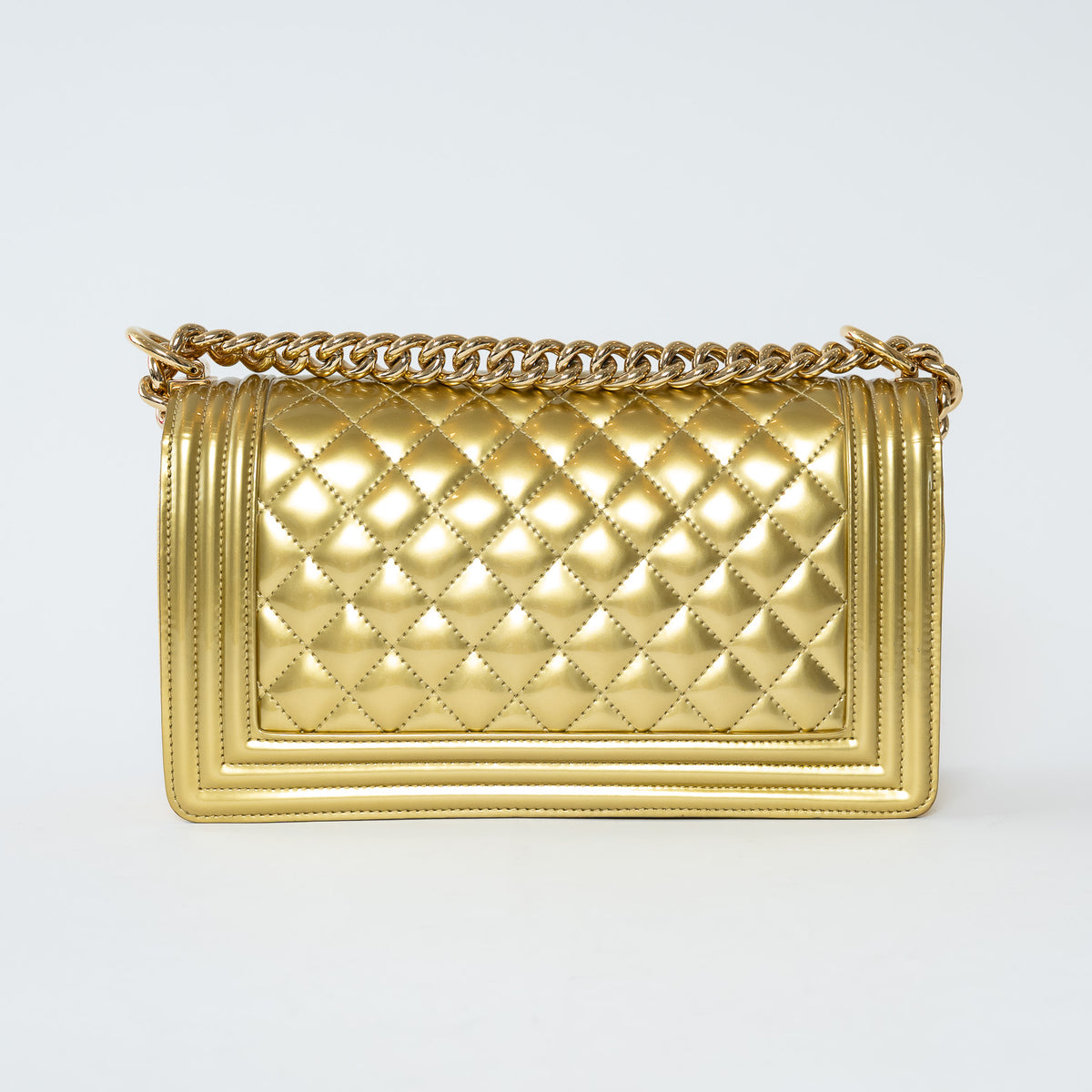 Pre-Loved Chanel™ Gold Patent Leather Medium Boy Bag