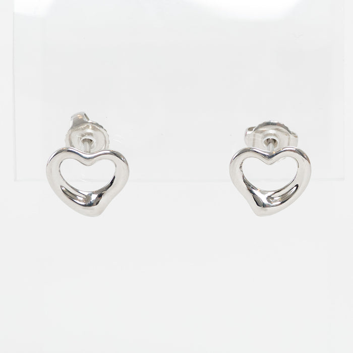 Silver heart-shaped earrings on a white background