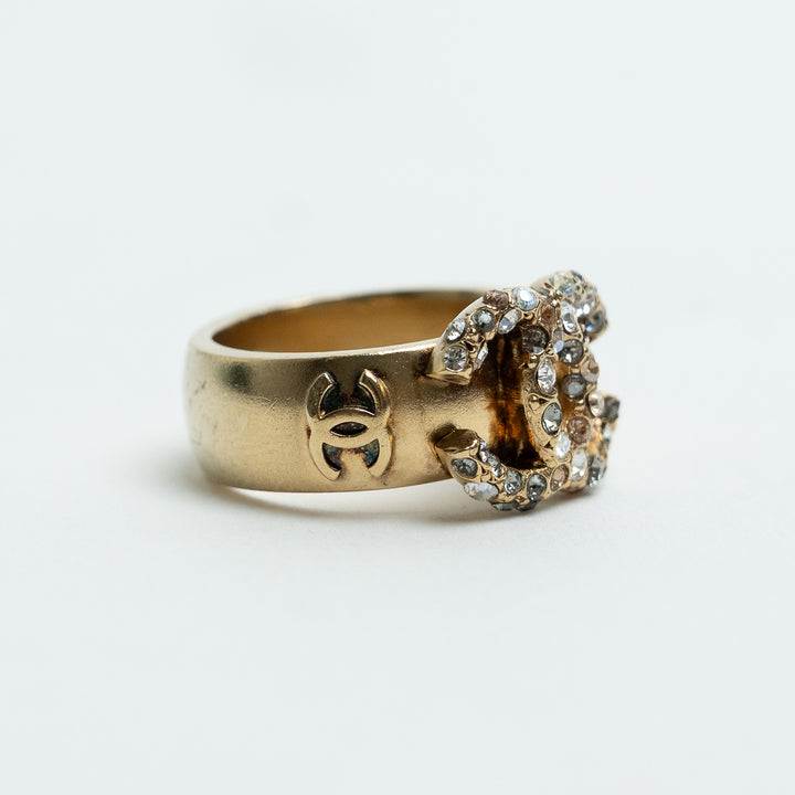 Pre-Loved Chanel™ Gold Tone Interlocking Logo Crystal Embellished Ring Size 53