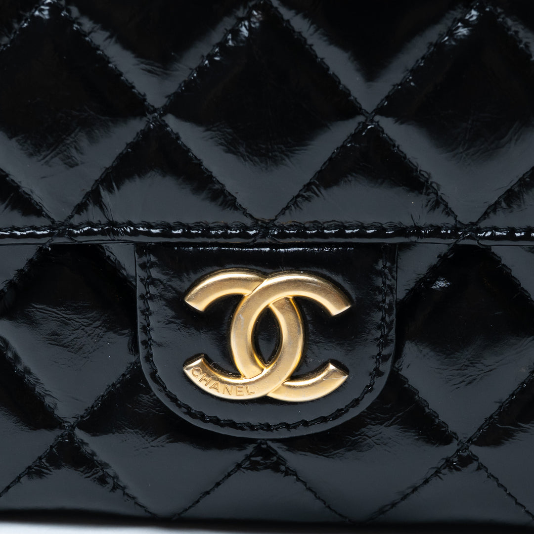 Pre-Loved Chanel™ Black Shiny Aged Calfskin Leather Small Wave Hobo Bag