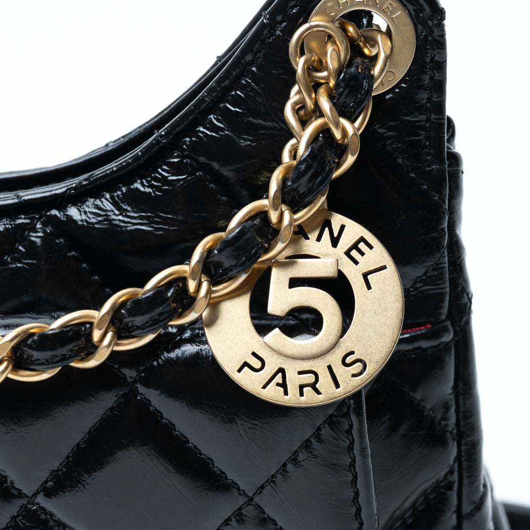 Pre-Loved Chanel™ Black Shiny Aged Calfskin Leather Small Wave Hobo Bag