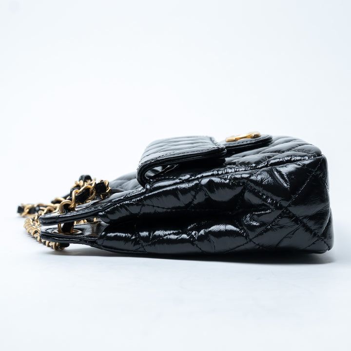 Pre-Loved Chanel™ Black Shiny Aged Calfskin Leather Small Wave Hobo Bag