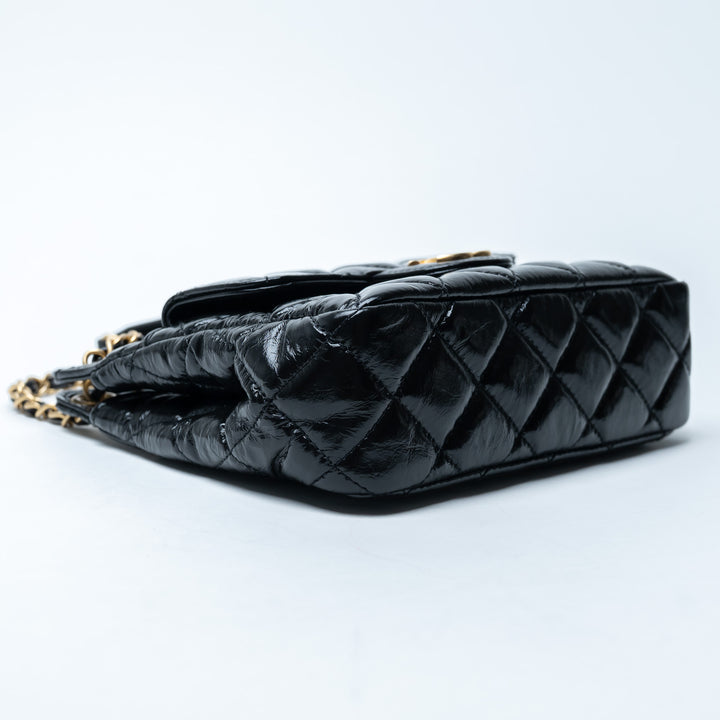 Pre-Loved Chanel™ Black Shiny Aged Calfskin Leather Small Wave Hobo Bag