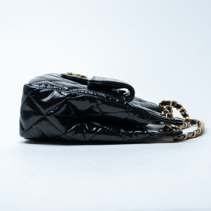 Pre-Loved Chanel™ Black Shiny Aged Calfskin Leather Small Wave Hobo Bag