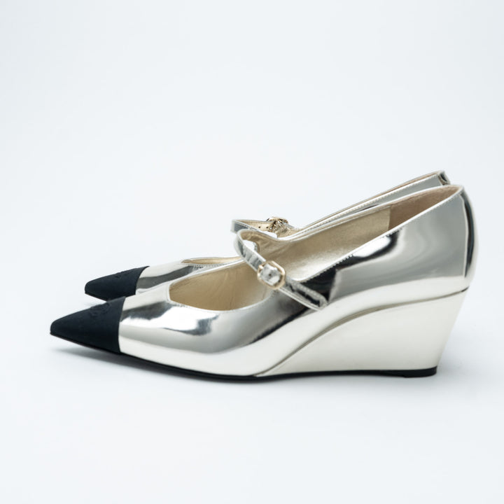 Silver Metallic Leather Cap Toe Wedge Mary Janes. (front)