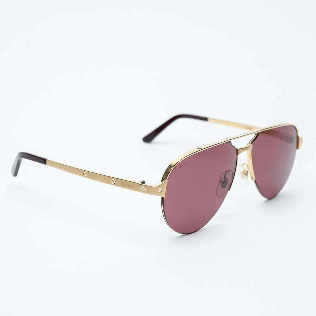 Gold Metal Santos de Cartier Aviator Sunglasses with Burgundy Lenses. (front)