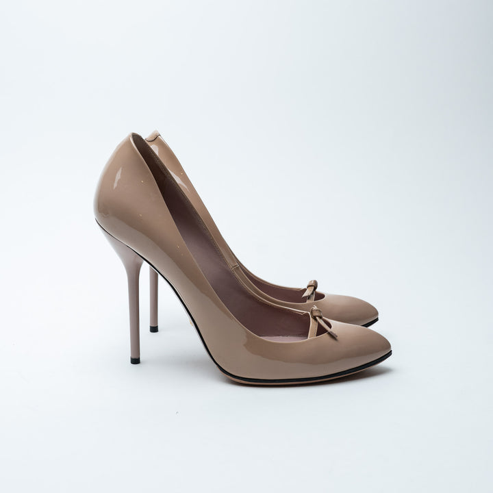 Nude Patent Leather Bow Pumps. (front)