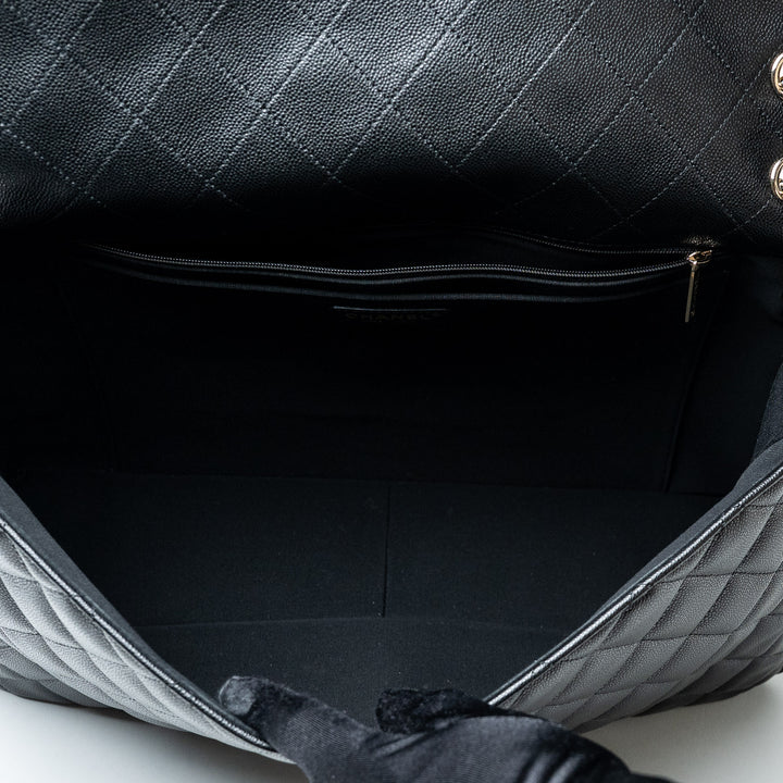 Black Caviar Leather XL Single Flap Bag. (view 8)