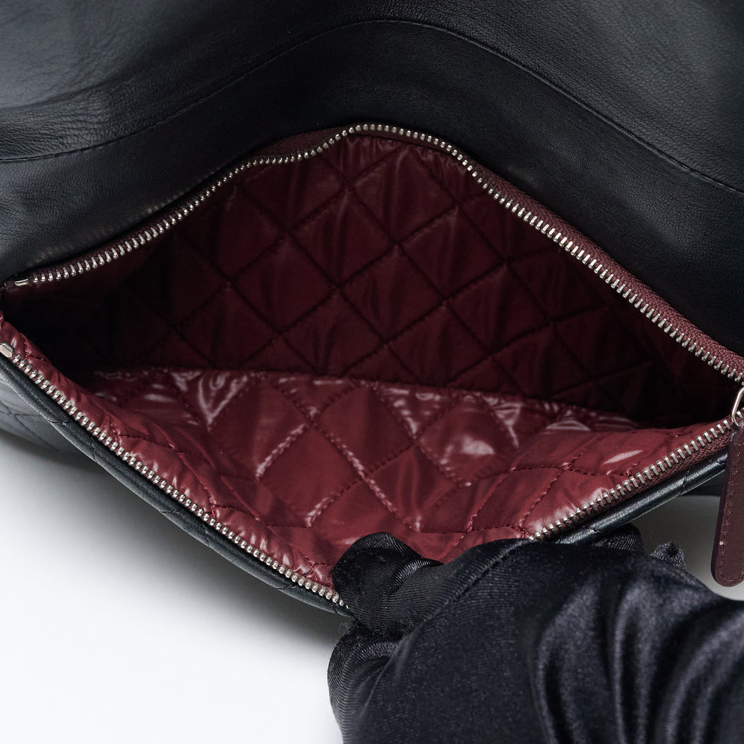 Black Lambskin Leather Quilted Fold-Over Clutch. (view 9)