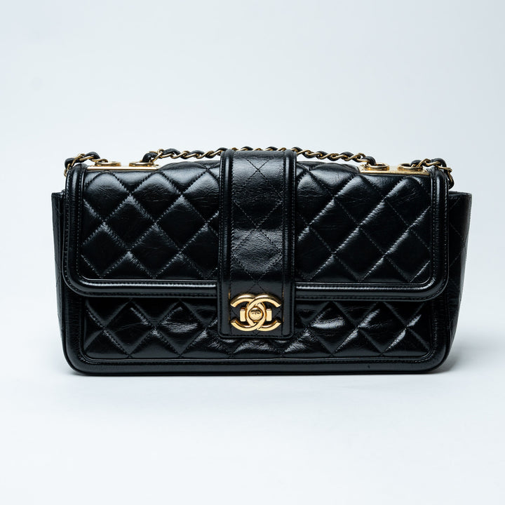 Black Quilted Lambskin Leather Single Flap Bag. (front)