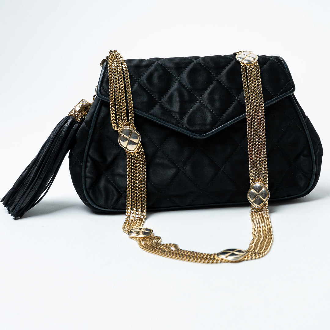 Black Quilted Satin Vintage Tassel Flap Bag. (front)