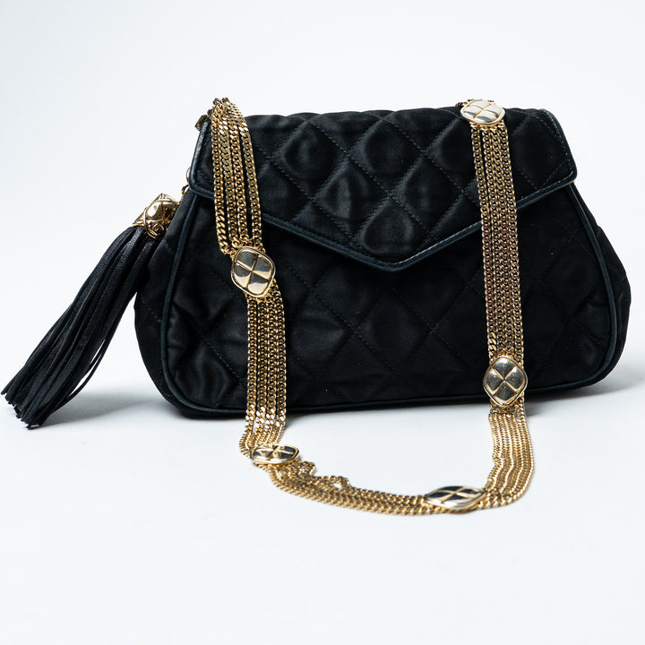 Black Quilted Satin Vintage Tassel Flap Bag. (front)