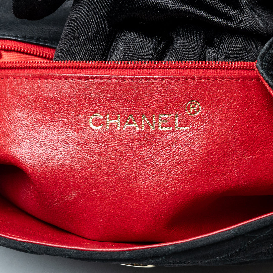 Black Quilted Satin Vintage Tassel Flap Bag. (view 10)